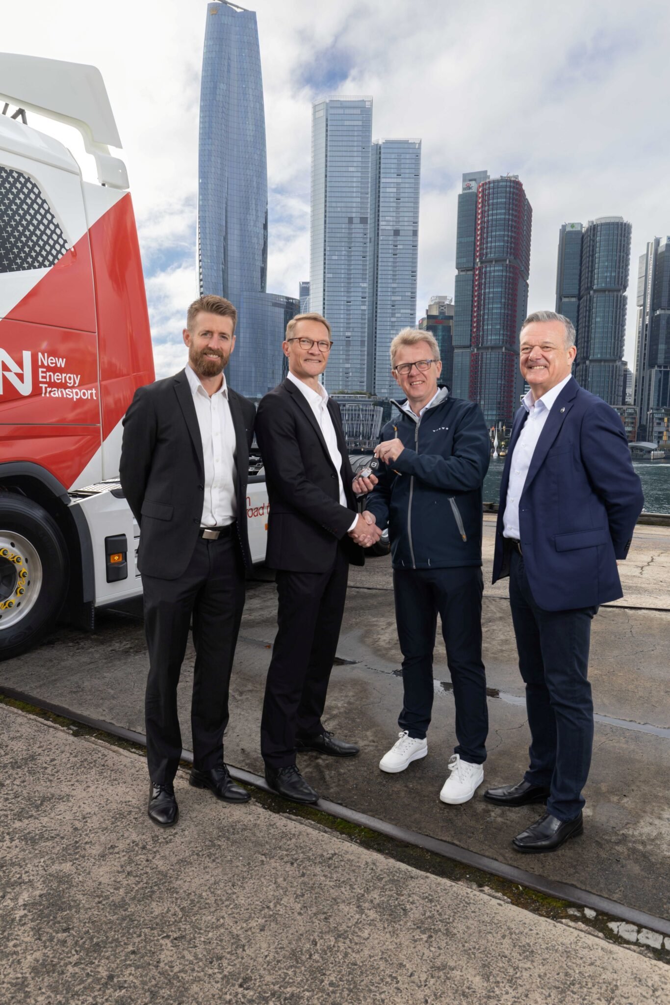 President of Volvo Trucks Roger Alm and President of Volvo Group Australia Martin Merrick handing the keys of New Energy Transport's first electric prime mover to NET's Co-CEO's Daniel Bleakley and Fredrik Pehrsson.